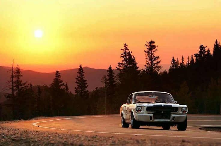 A classic car on a scenic road